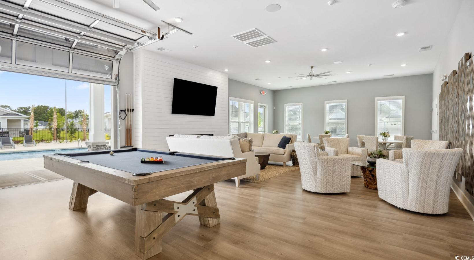 31 Quaker Rdg Drive, Unit MEANDER Carolina Shores, NC 28467 - Photo 11 of 38 Game room with a ceiling fan, pool table, light wood-type flooring, and recessed lighting