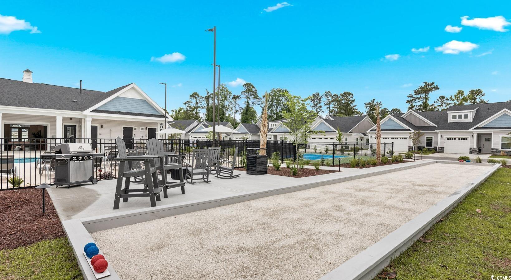 31 Quaker Rdg Drive, Unit MEANDER Carolina Shores, NC 28467 - Photo 12 of 38 View of property's community with a residential view