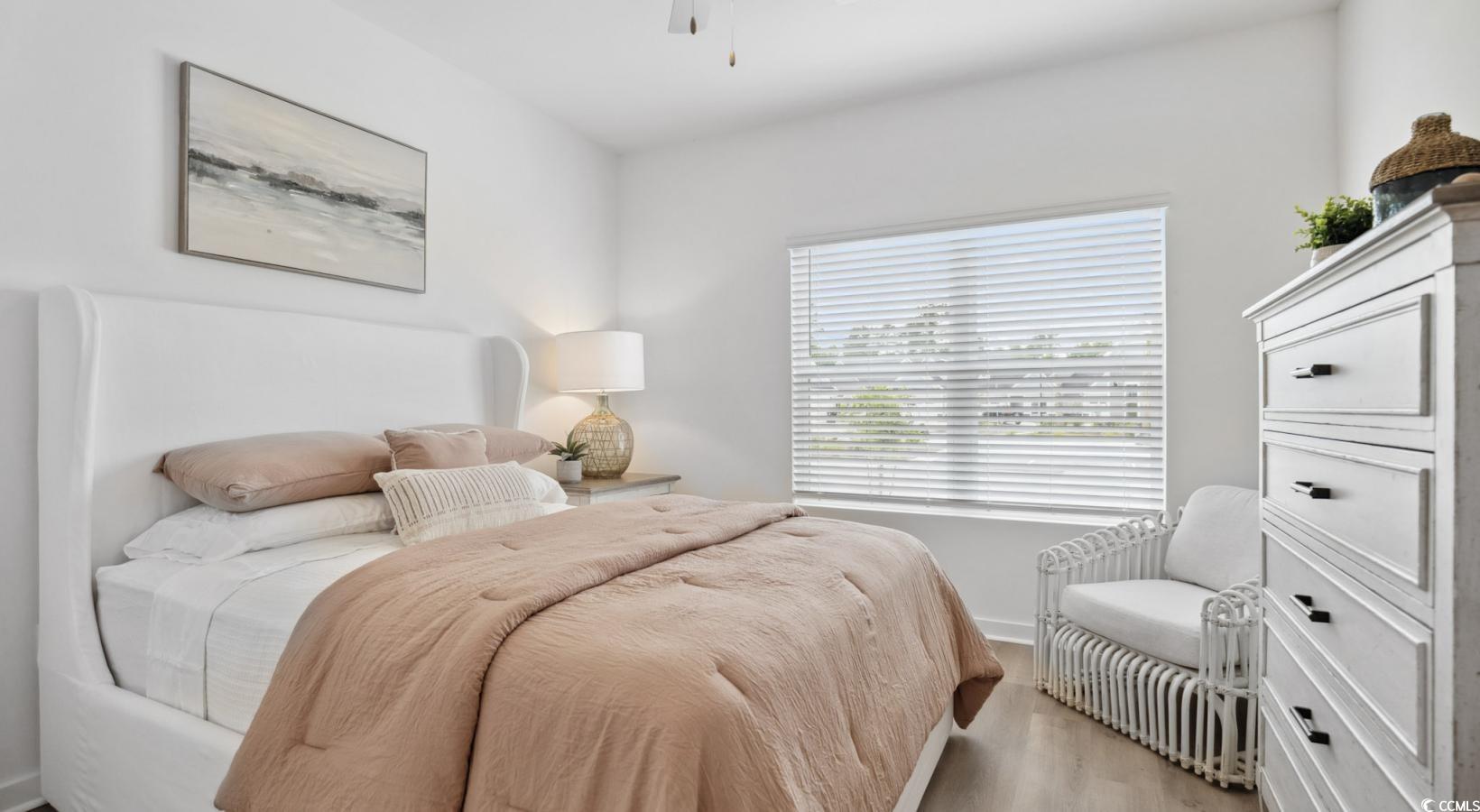 31 Quaker Rdg Drive, Unit MEANDER Carolina Shores, NC 28467 - Photo 22 of 38 Bedroom featuring wood finished floors and a ceiling fan