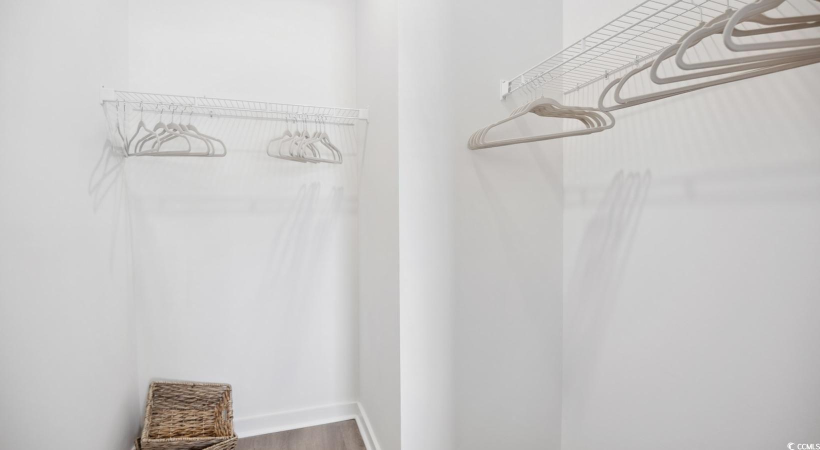 31 Quaker Rdg Drive, Unit MEANDER Carolina Shores, NC 28467 - Photo 23 of 38 Spacious closet with wood finished floors