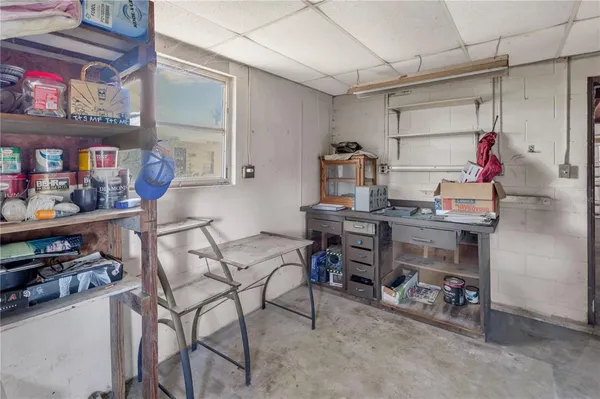 a room with furniture a rug and a window