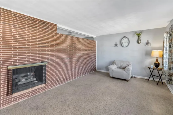 a view of livingroom with furniture and fireplace