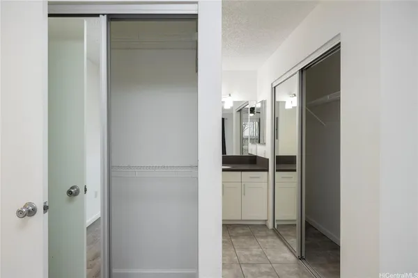 a bathroom with a shower and a sink