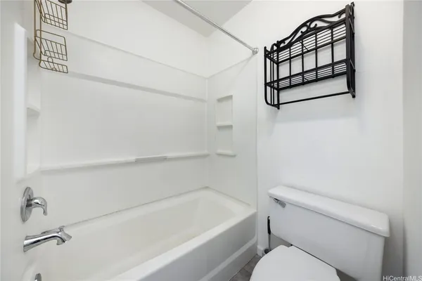 a bathroom with a toilet and a bathtub