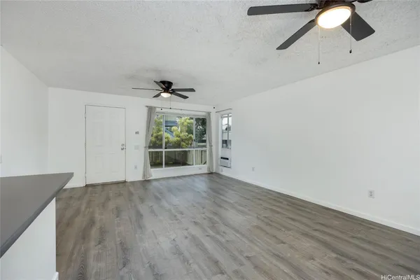 a view of an empty room with a window