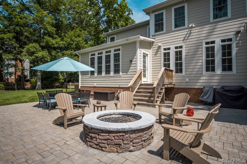 13811 Elmstead Road Midlothian, VA 23113 - Photo 45 of 50 a view of house with backyard and outdoor seating