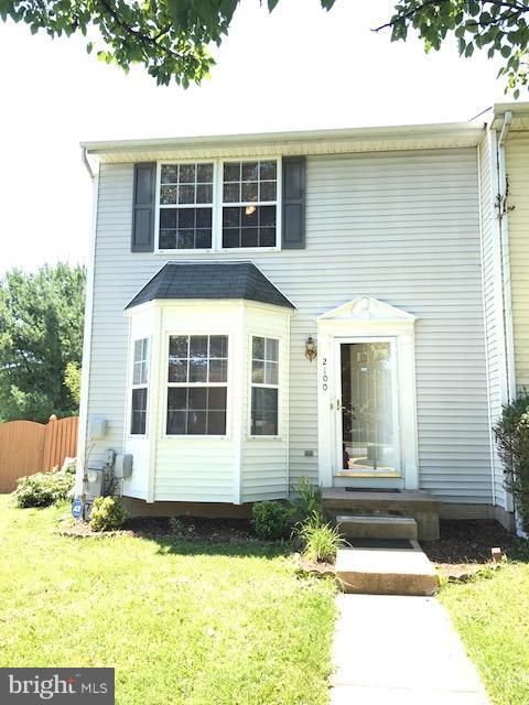 2100 Riding Crop Way Baltimore, MD 21244 - Photo 1 of 10 a front view of a house having yard