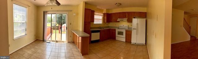 2100 Riding Crop Way Baltimore, MD 21244 - Photo 4 of 10 a kitchen with stainless steel appliances granite countertop a refrigerator and a stove