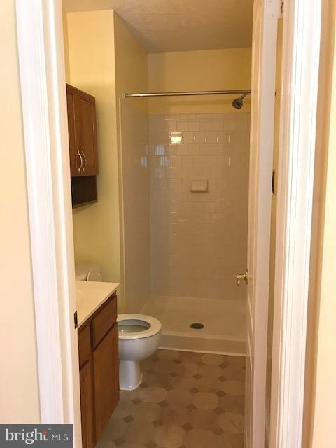 2100 Riding Crop Way Baltimore, MD 21244 - Photo 6 of 10 a bathroom with a granite countertop sink toilet and shower