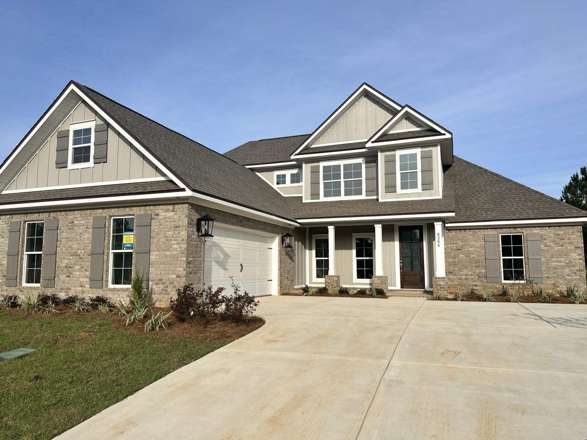 6264 Howie Way Pace, FL 32571 - Photo 1 of 34 a front view of a house with a yard