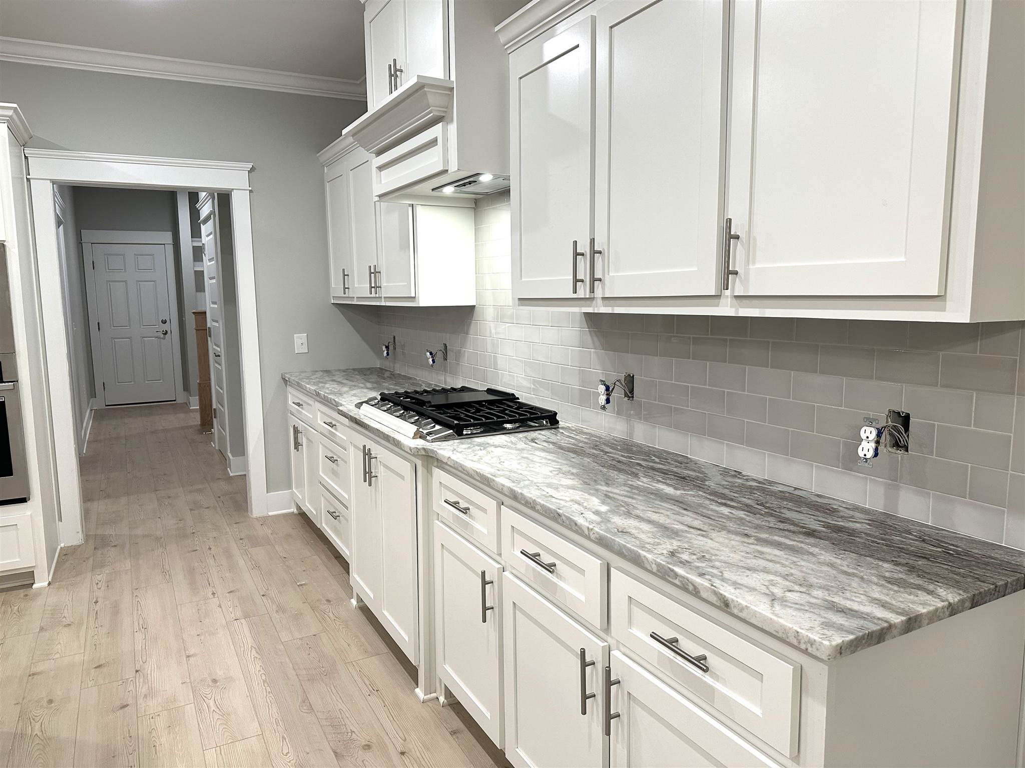 6264 Howie Way Pace, FL 32571 - Photo 11 of 34 a kitchen with granite countertop a sink stainless steel appliances white cabinets and a window