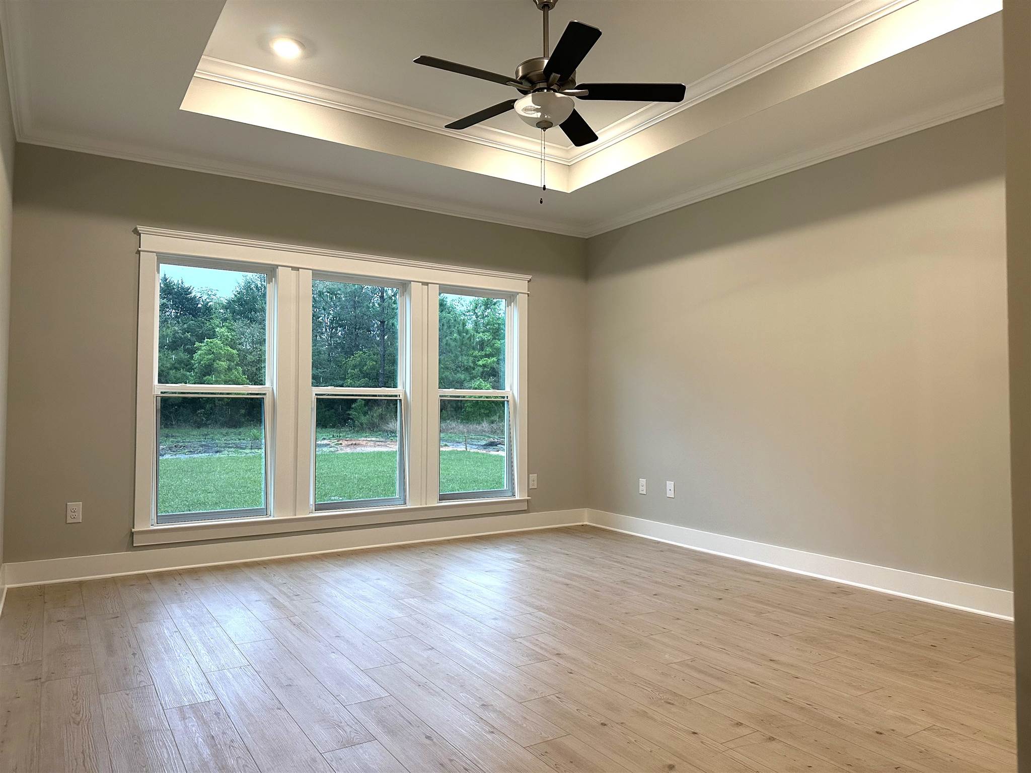 6264 Howie Way Pace, FL 32571 - Photo 12 of 34 a view of room with window and wooden floor