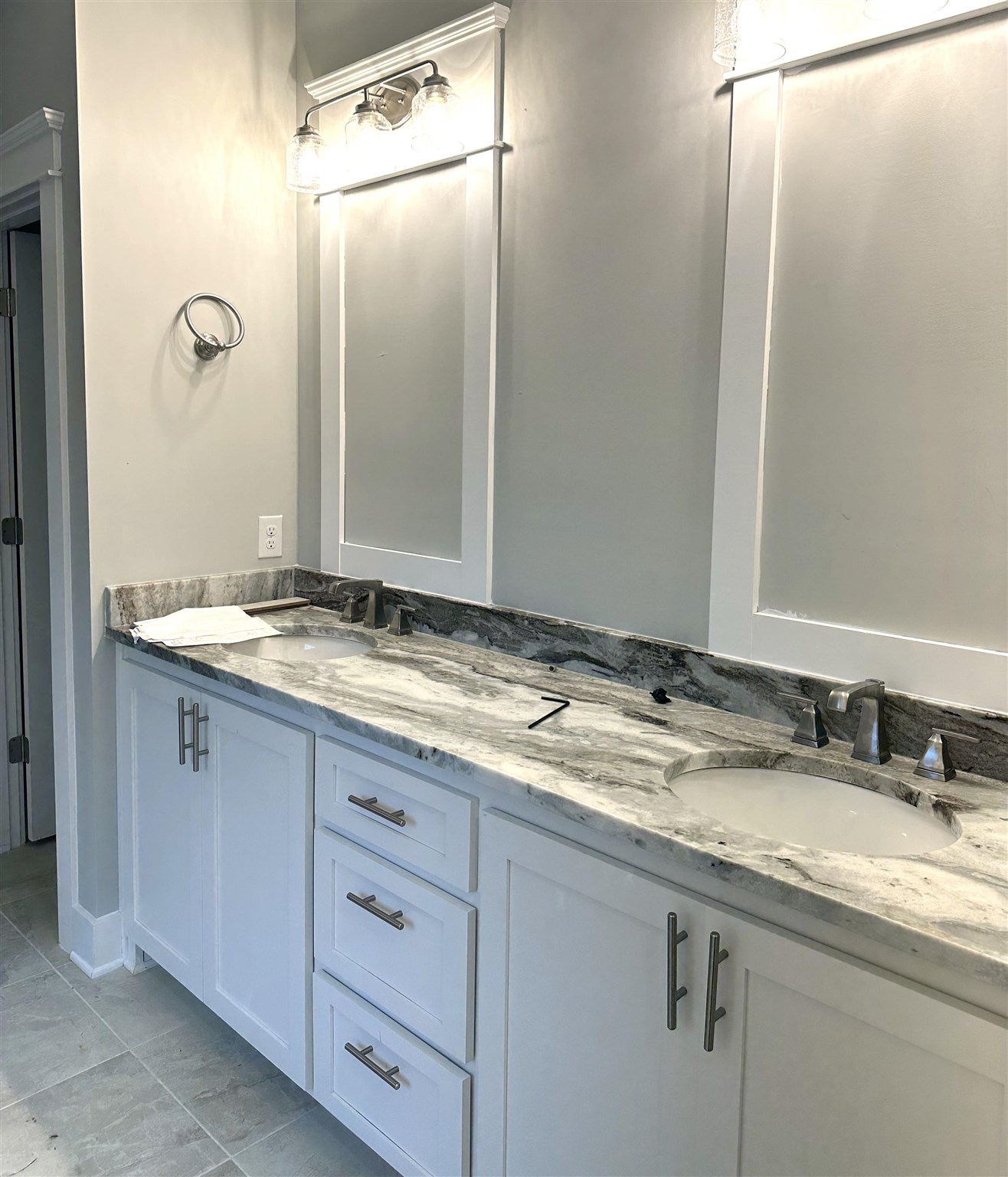 6264 Howie Way Pace, FL 32571 - Photo 13 of 34 a bathroom with a granite countertop sink and a mirror