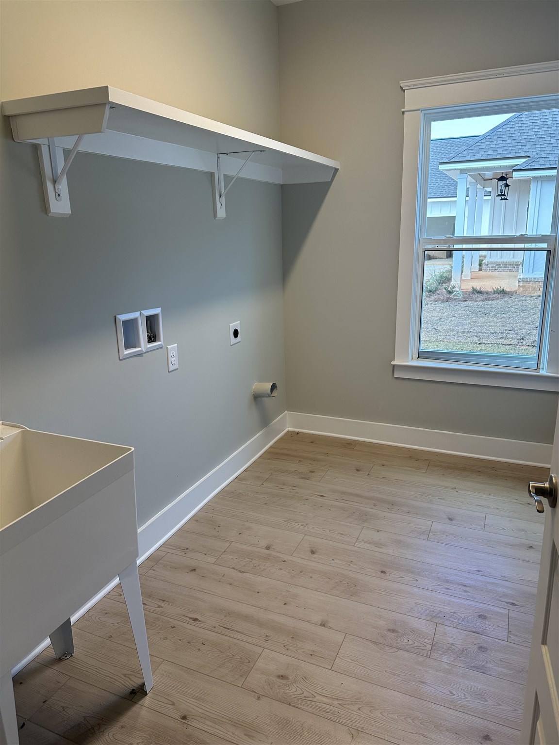 6264 Howie Way Pace, FL 32571 - Photo 21 of 34 a view of an empty room with wooden floor and a window