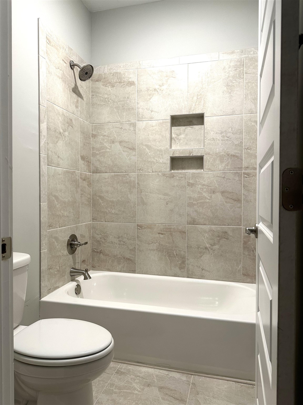 6264 Howie Way Pace, FL 32571 - Photo 23 of 34 a bathroom with a shower and a toilet