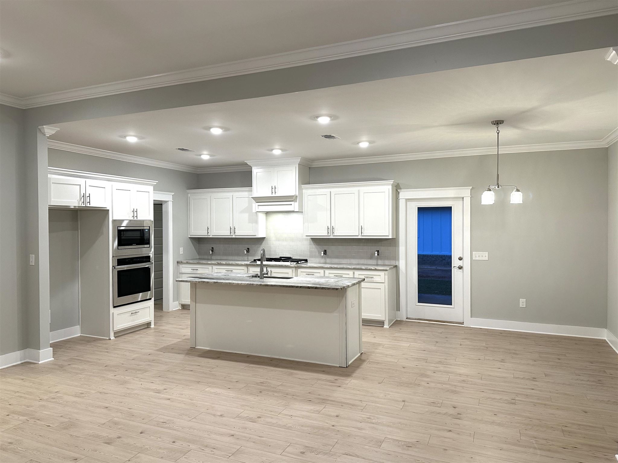 6264 Howie Way Pace, FL 32571 - Photo 9 of 34 a kitchen with stainless steel appliances granite countertop a refrigerator and a stove top oven