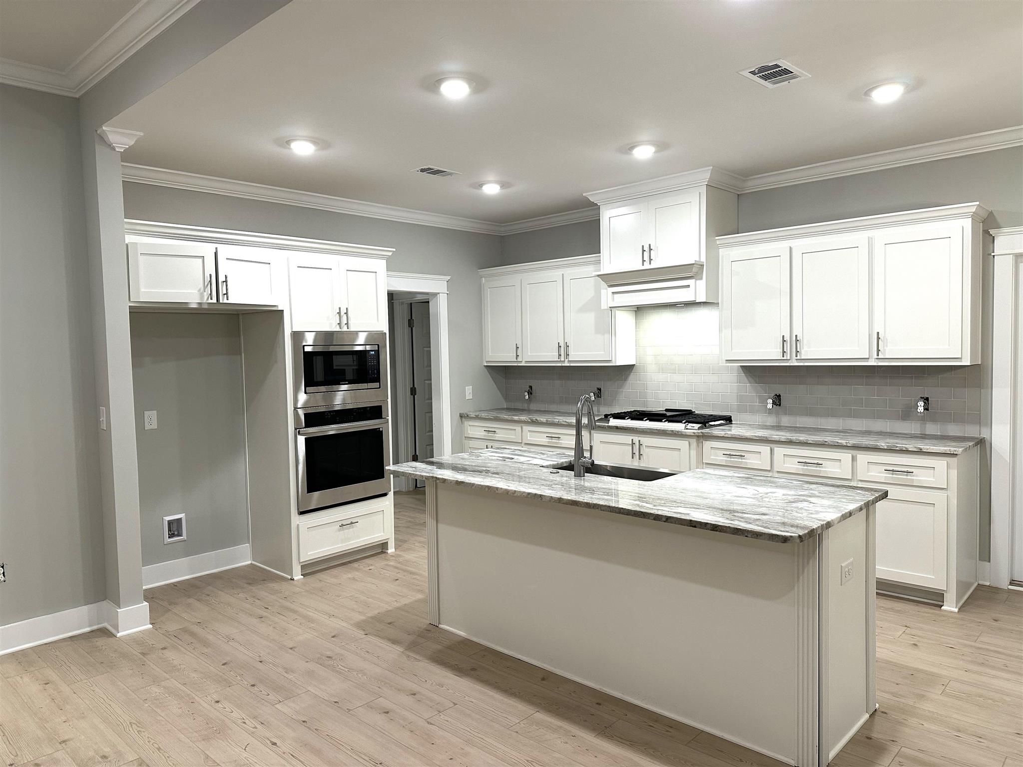 6264 Howie Way Pace, FL 32571 - Photo 10 of 34 a kitchen with stainless steel appliances granite countertop a sink stove and refrigerator