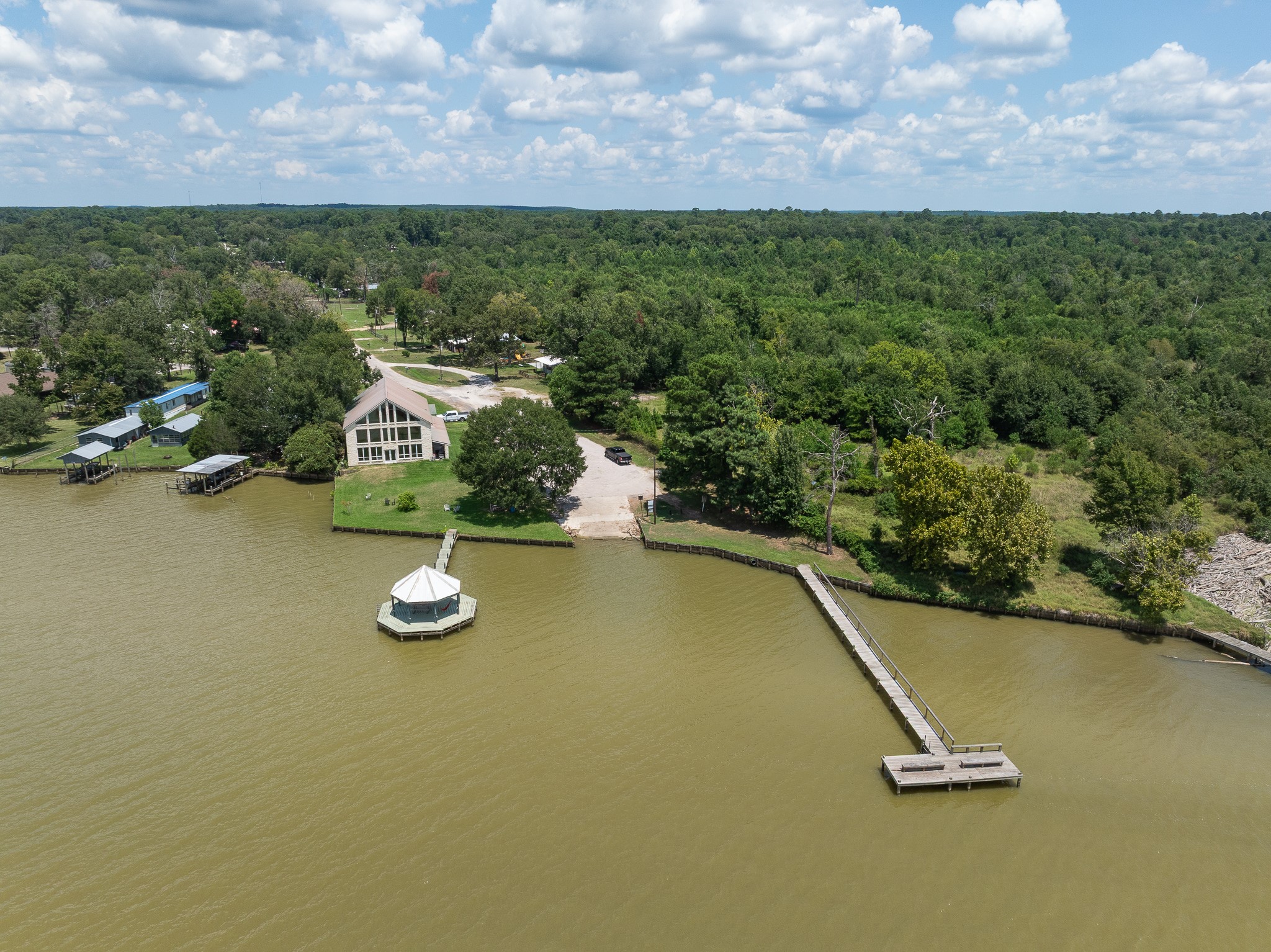 Tba Buzzard Roost Trail Trinity, TX 75862 - Photo 17 of 21 a view of a swimming pool with a yard and mountain in the back