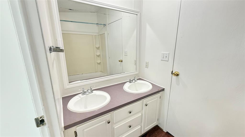 3789 Jacobs Lane Kaufman, TX 75142 - Photo 24 of 33 a bathroom with a sink and a mirror