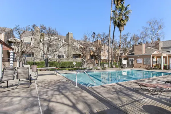 a view of a house with a yard and tree s