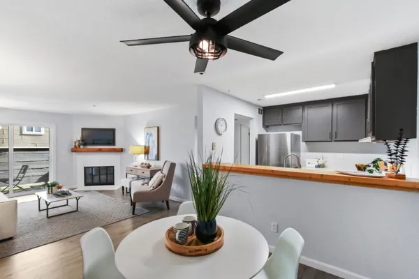a living room with fireplace furniture and a flat screen tv