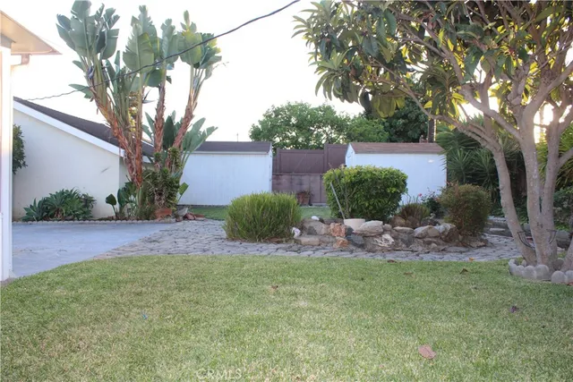 a view of a house with a backyard porch and sitting area
