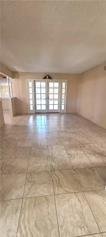 a kitchen with a sink a stove cabinets and a window