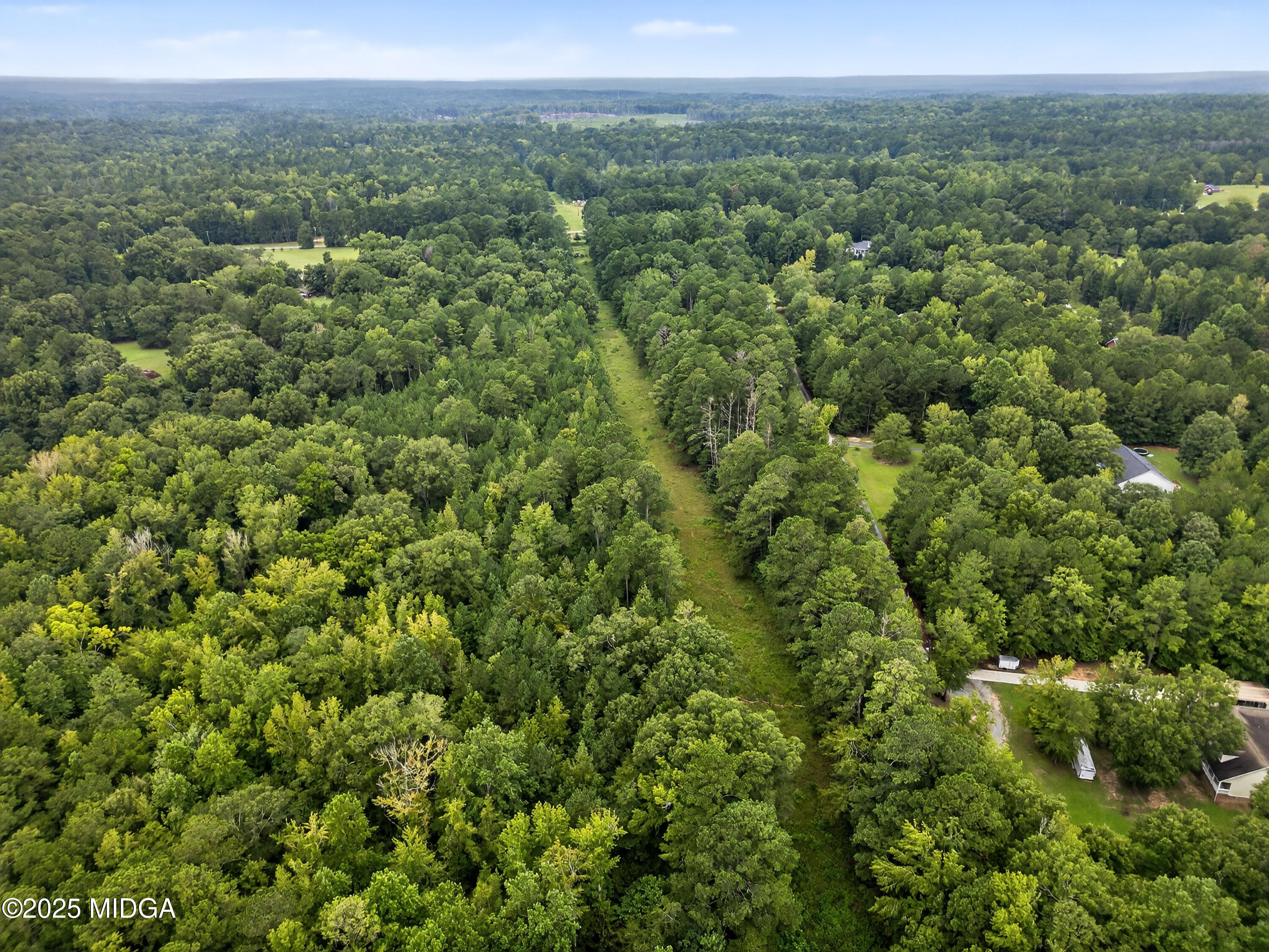 615 Lite-N-Tie Road Gray, GA 31032 - Photo 13 of 19 a view of a green field with lots of bushes