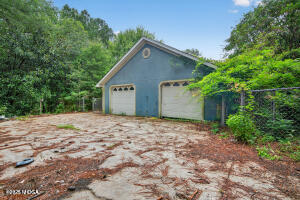 615 Lite-N-Tie Road Gray, GA 31032 - Photo 3 of 19 a view of a house with a yard and garage
