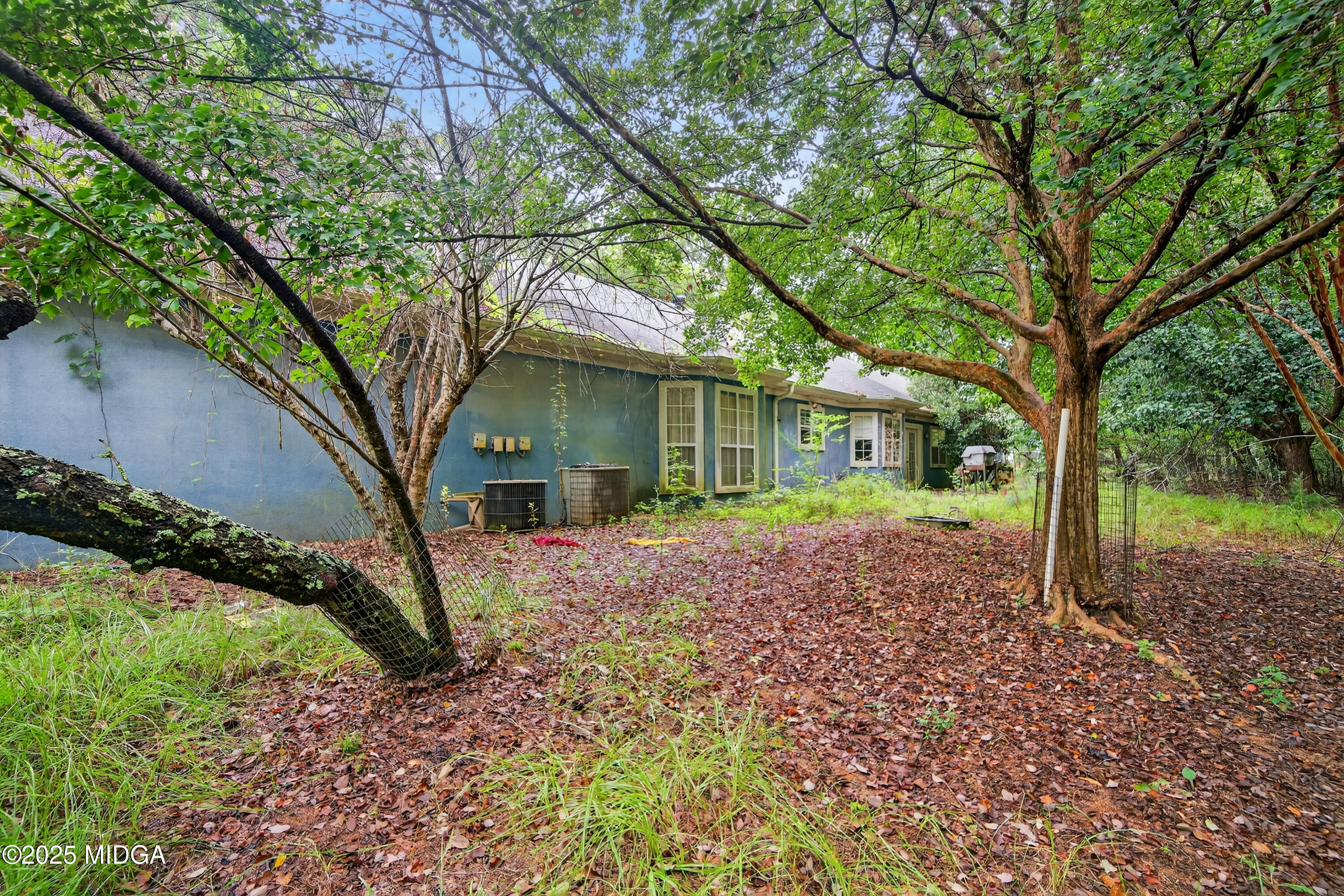 615 Lite-N-Tie Road Gray, GA 31032 - Photo 4 of 19 a house with trees in front of it