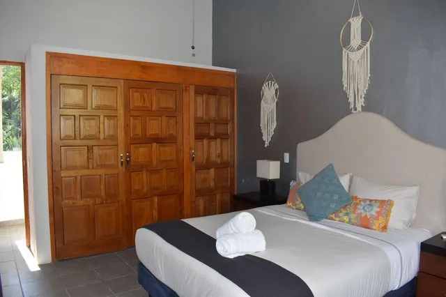 a bedroom with a bed and a table