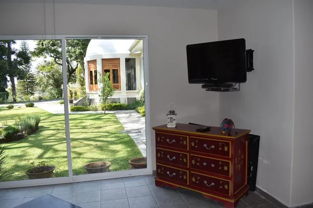 a living room with a flat screen tv and a fireplace