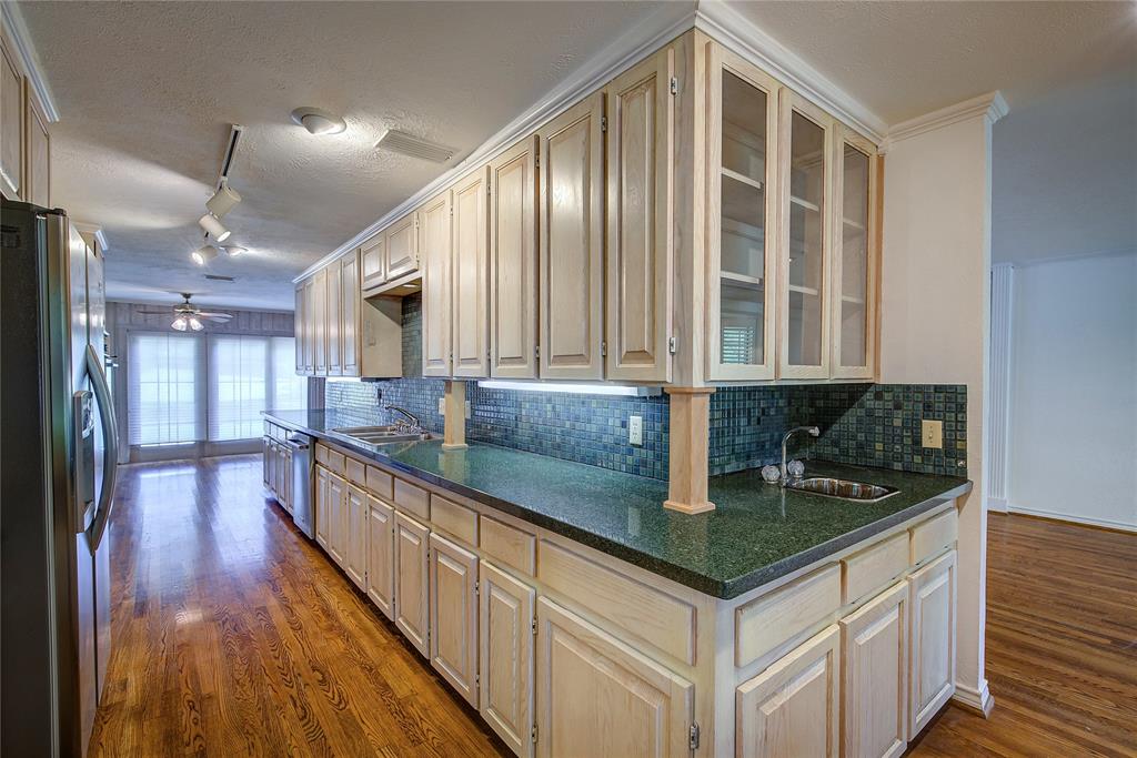 18 Mullaney Road Greenville, TX 75402 - Photo 11 of 37 a kitchen with counter top space and wooden floor