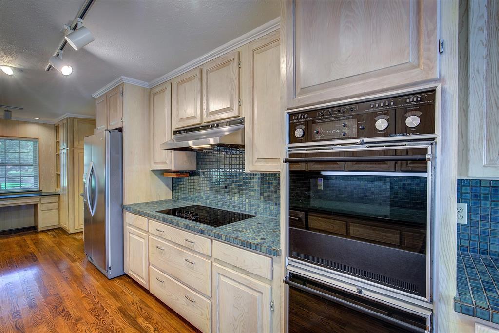 18 Mullaney Road Greenville, TX 75402 - Photo 15 of 37 a kitchen with granite countertop cabinets and steel stainless steel appliances