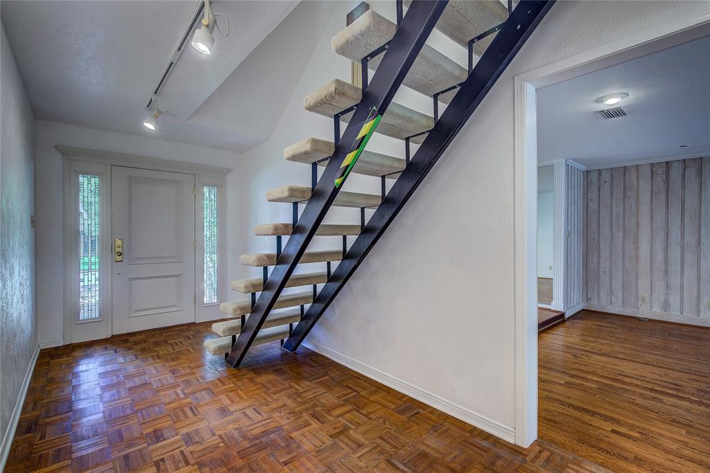 18 Mullaney Road Greenville, TX 75402 - Photo 2 of 37 wooden floor with an entryway