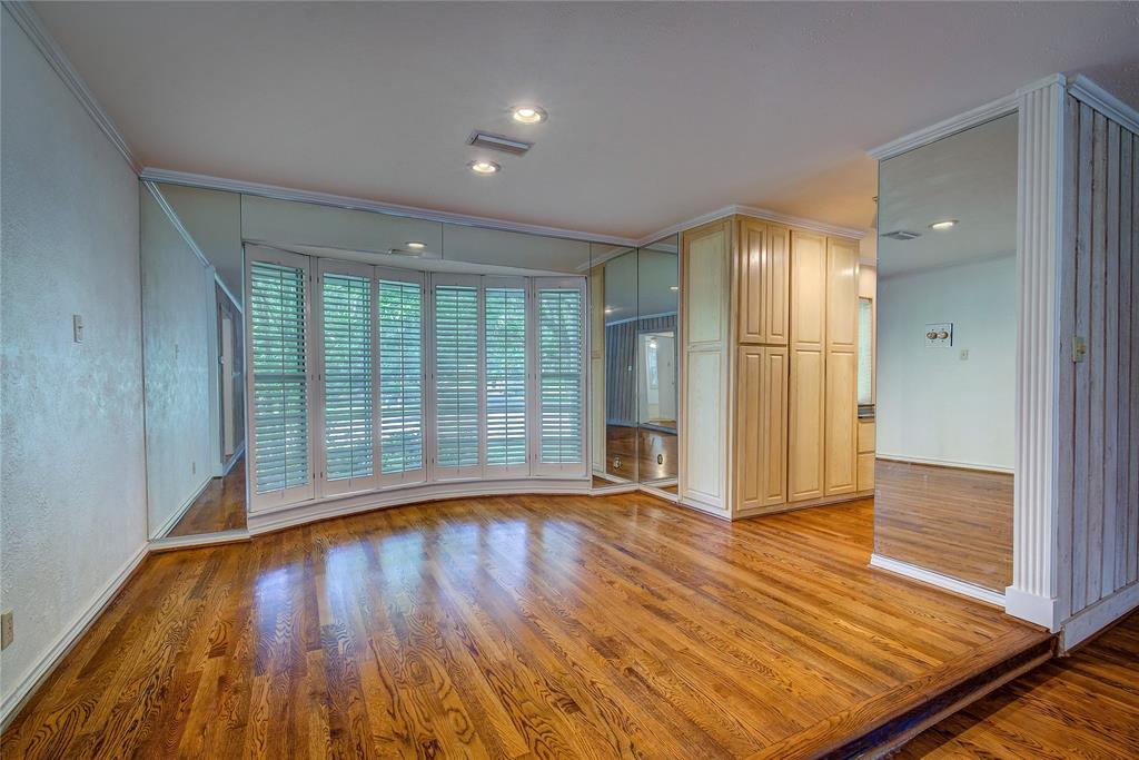 18 Mullaney Road Greenville, TX 75402 - Photo 7 of 37 wooden floor in an empty room with a window