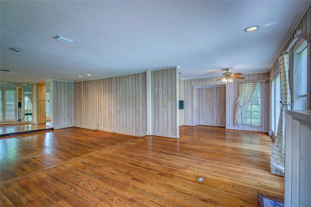 18 Mullaney Road Greenville, TX 75402 - Photo 8 of 37 a view of an empty room with window and wooden floor