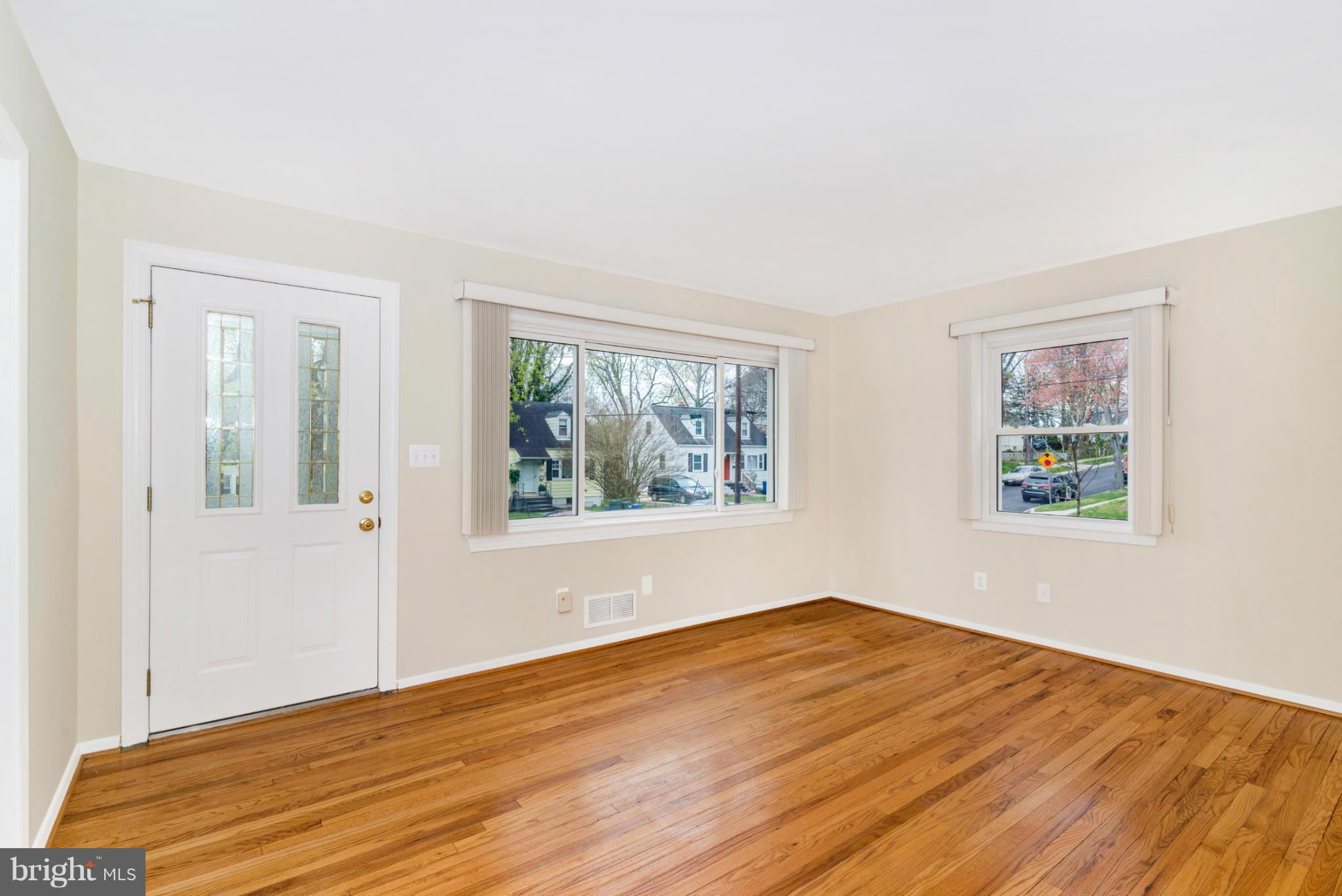 2801 Weisman Road Silver Spring, MD 20902 - Photo 2 of 30 a view of empty room with wooden floor and fan