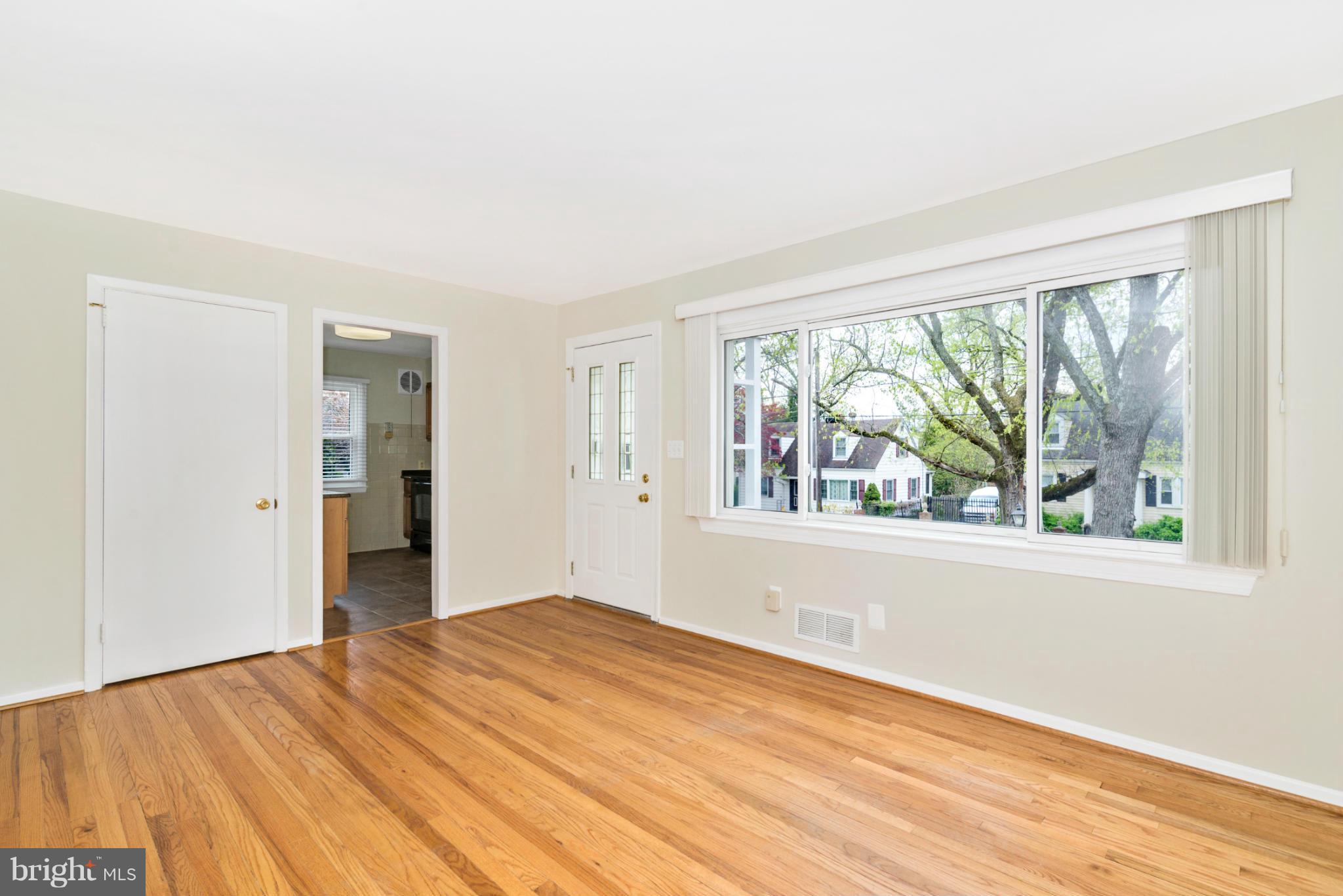 2801 Weisman Road Silver Spring, MD 20902 - Photo 3 of 30 a view of empty room with wooden floor and fan