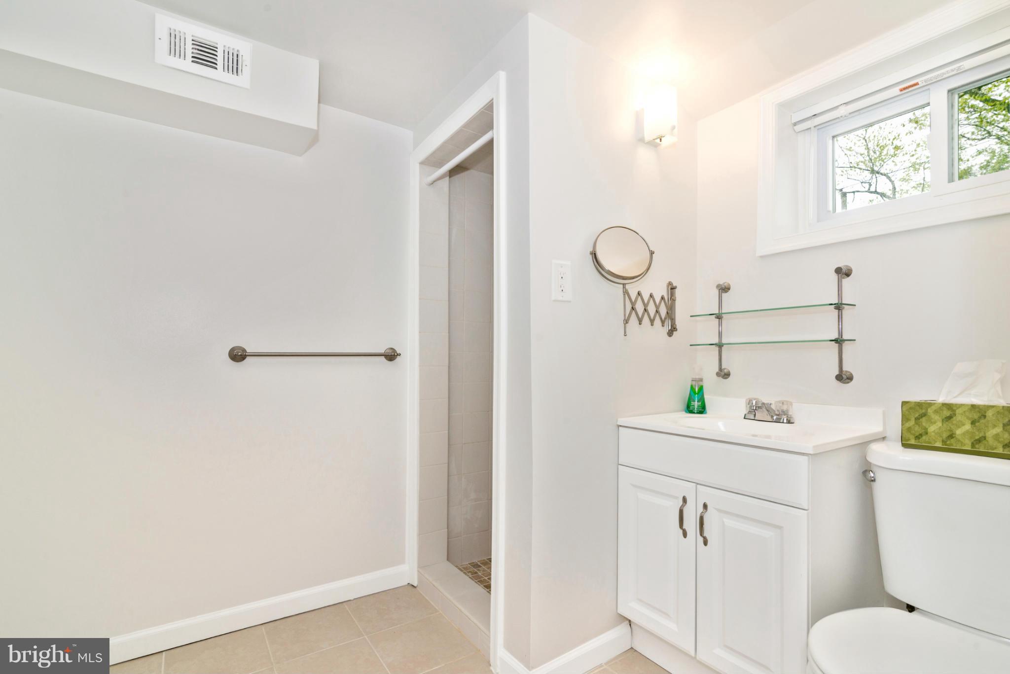 2801 Weisman Road Silver Spring, MD 20902 - Photo 23 of 30 a view of a bathroom sink and a window
