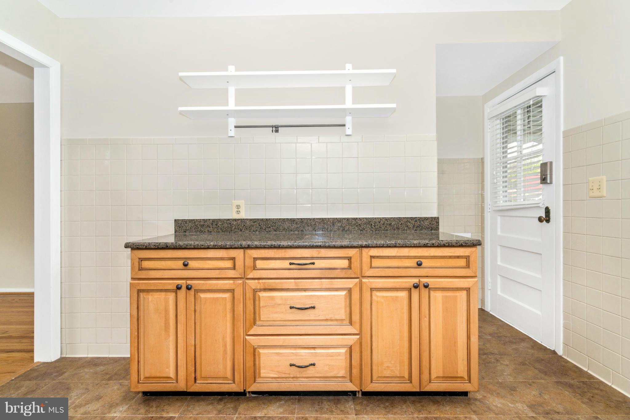 2801 Weisman Road Silver Spring, MD 20902 - Photo 8 of 30 a view of a cabinets with wooden floor