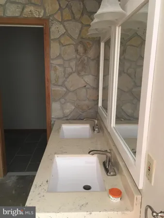 a bathroom with a sink and a shower