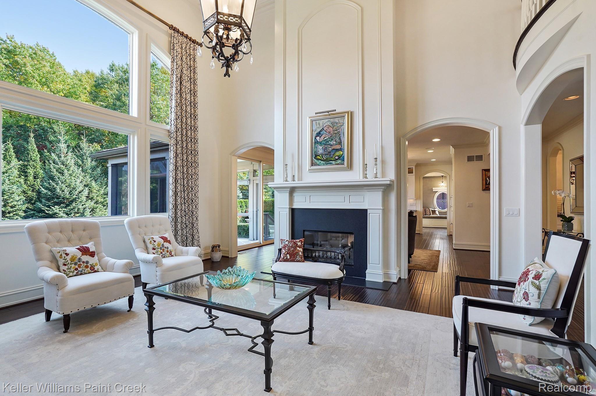 2772 North Addison Circle Rochester, MI 48306 - Photo 24 of 71 Dual-sided fireplace & beautiful views make for a serene space to relax