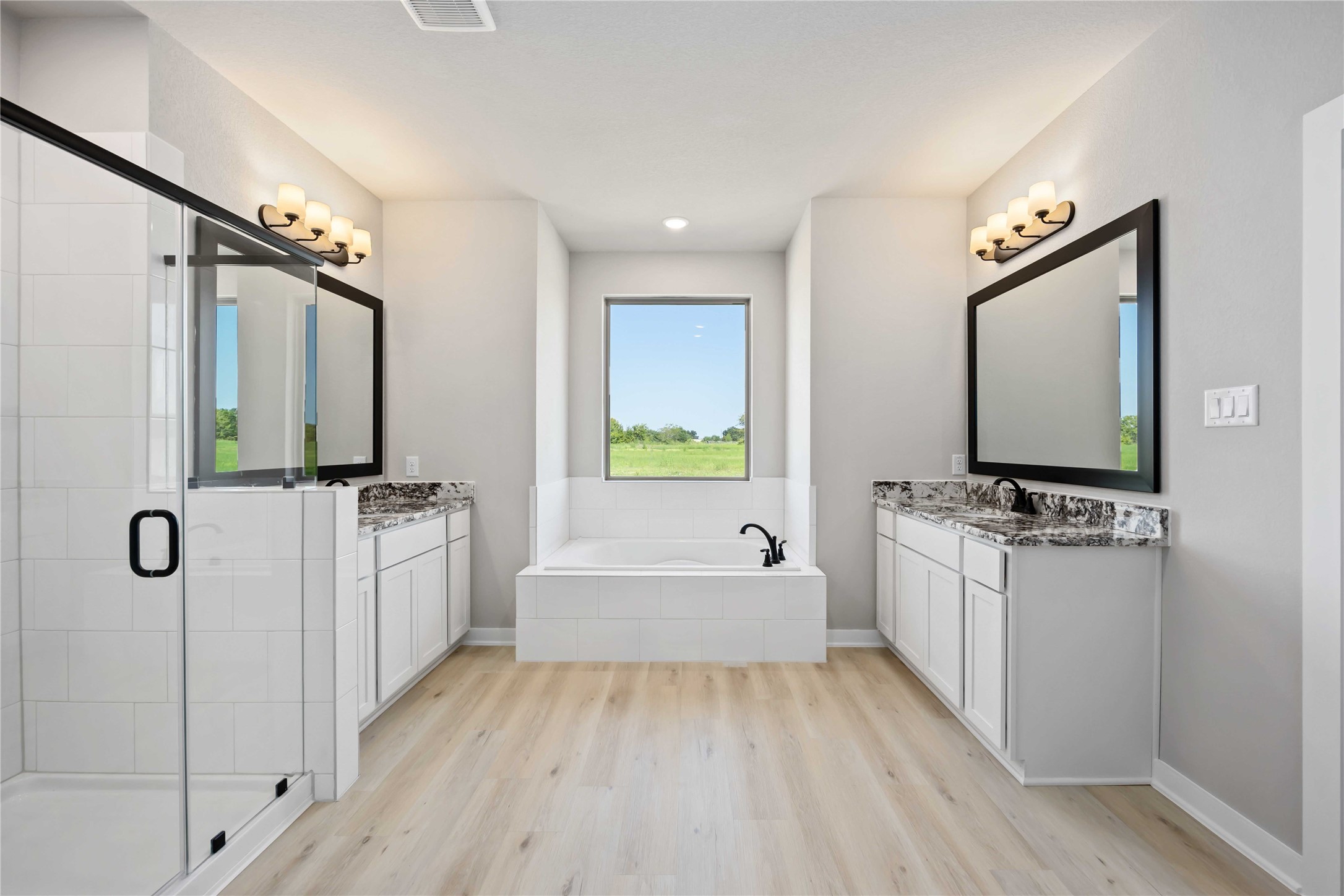 6702 Pelican Lane Beasley, TX 77417 - Photo 23 of 29 The luxurious owner's retreat is a private oasis with a spa-inspired bath and an extended walk-in closet.