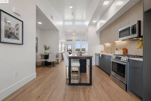 a kitchen with sink cabinets and wooden floor