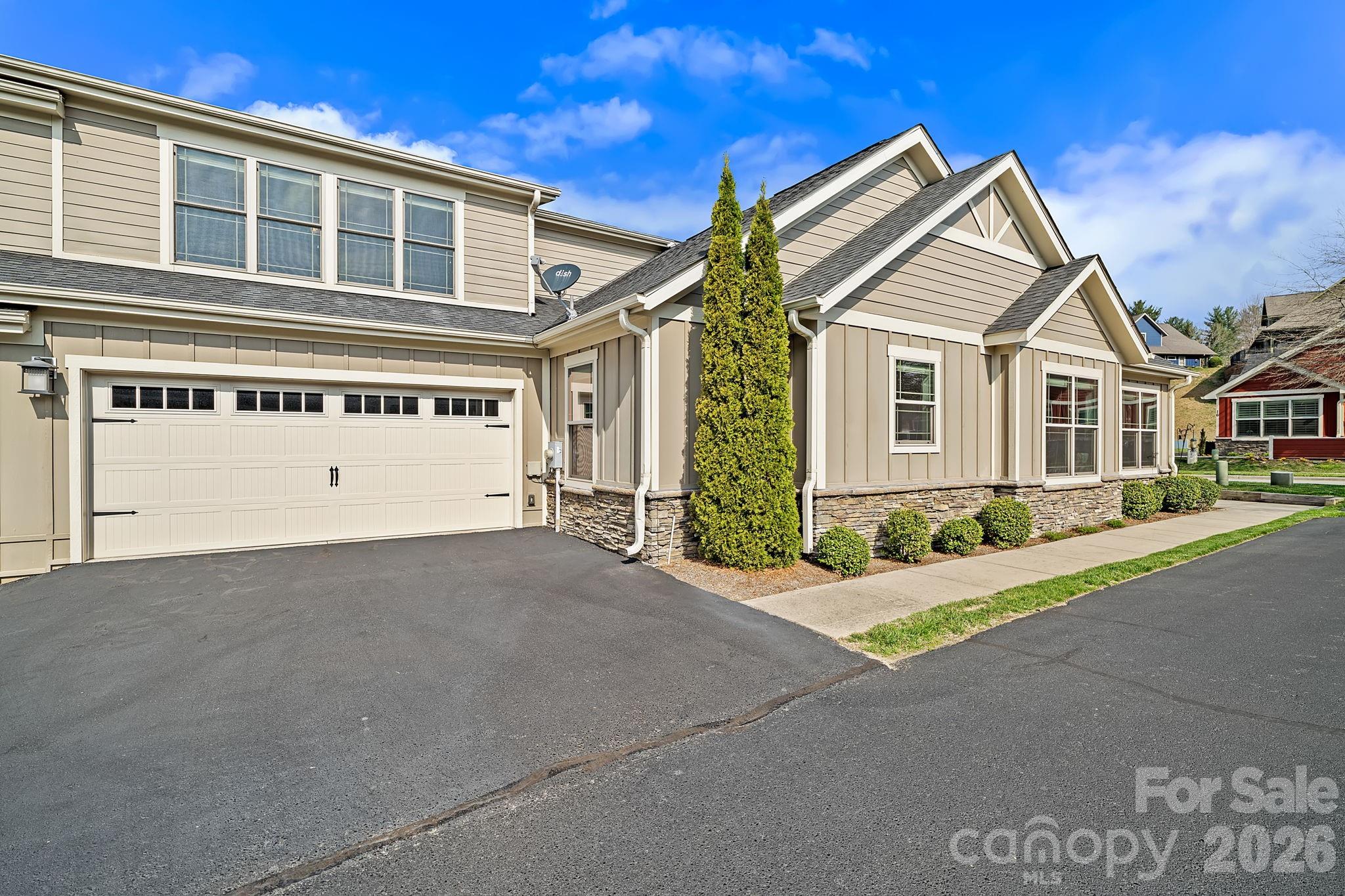 9 Brookstone Place Candler, NC 28715 - Photo 1 of 36 a view of house with yard in front of it