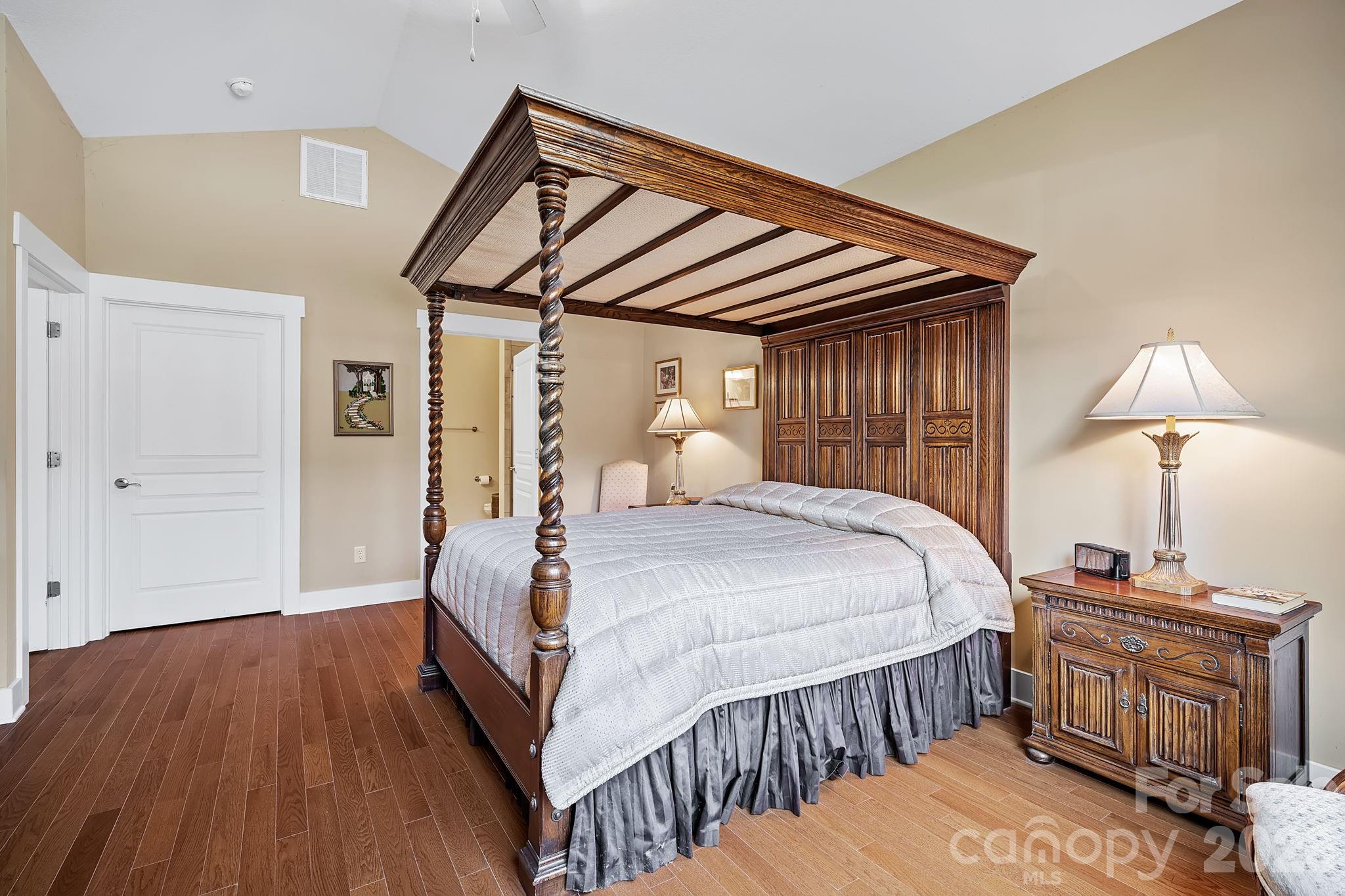 9 Brookstone Place Candler, NC 28715 - Photo 14 of 36 a bedroom with a bed and wooden floor