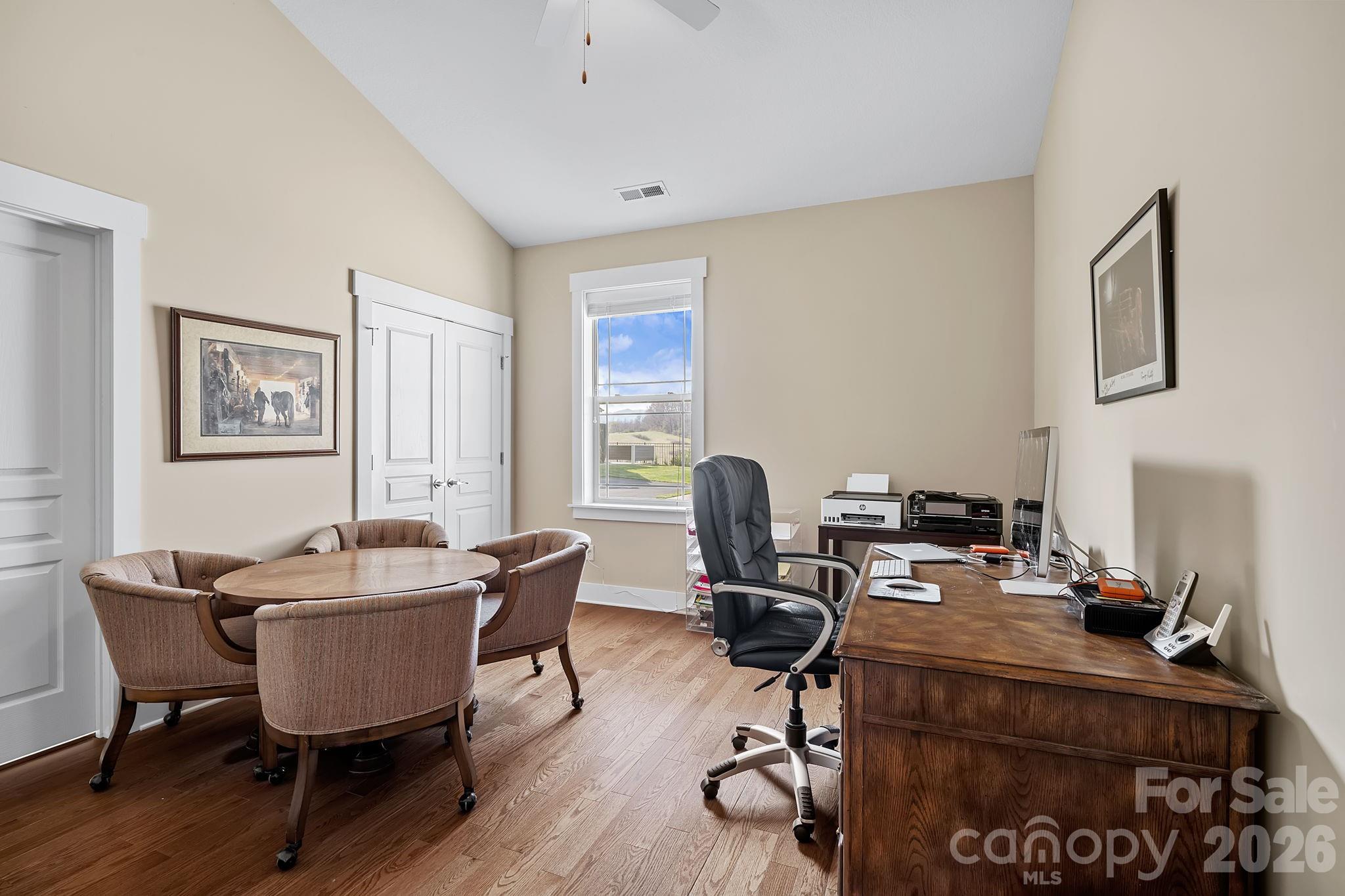 9 Brookstone Place Candler, NC 28715 - Photo 17 of 36 a view of a workspace with furniture and a window
