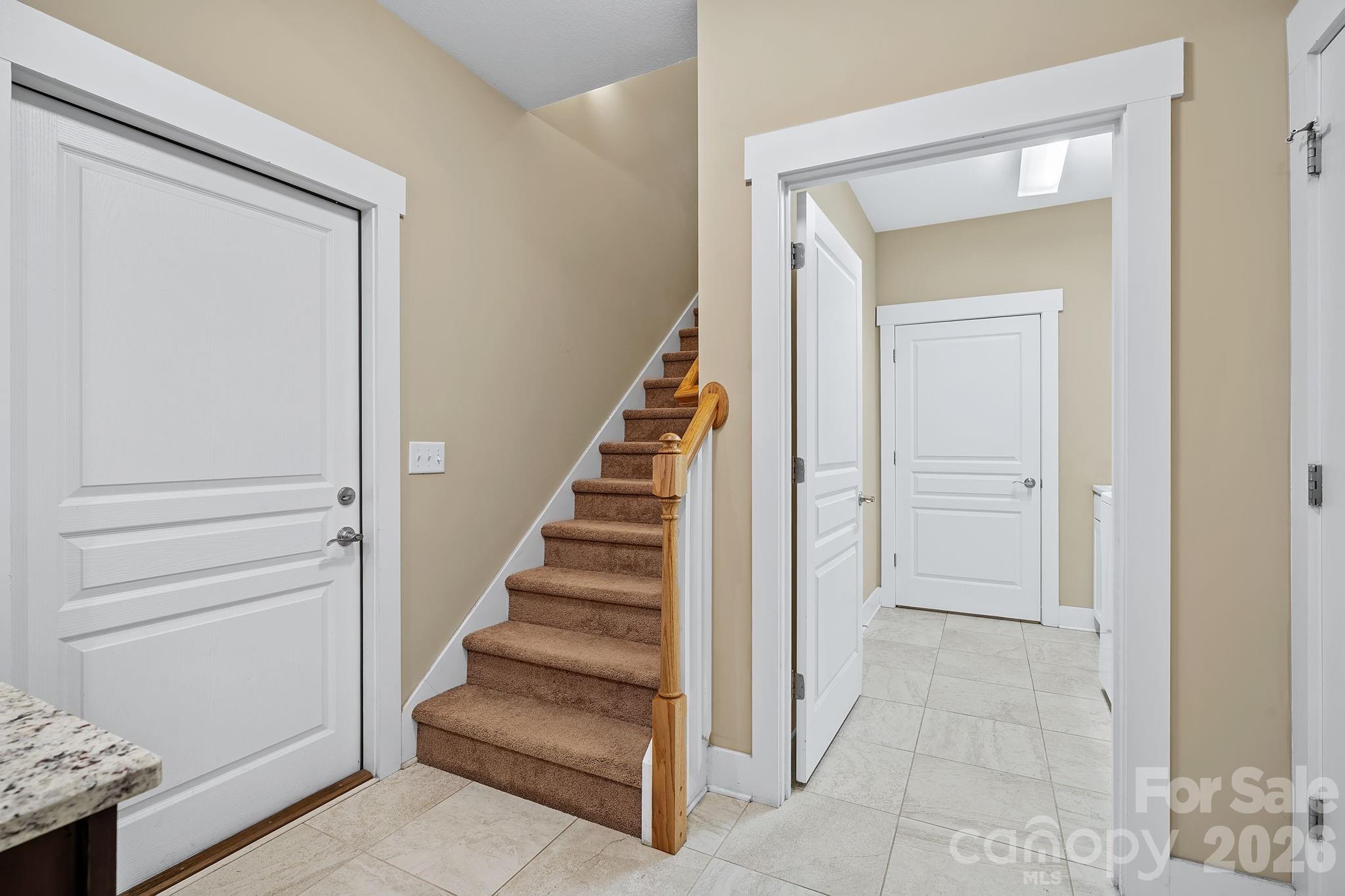 9 Brookstone Place Candler, NC 28715 - Photo 23 of 36 a view of entryway and hall with a door