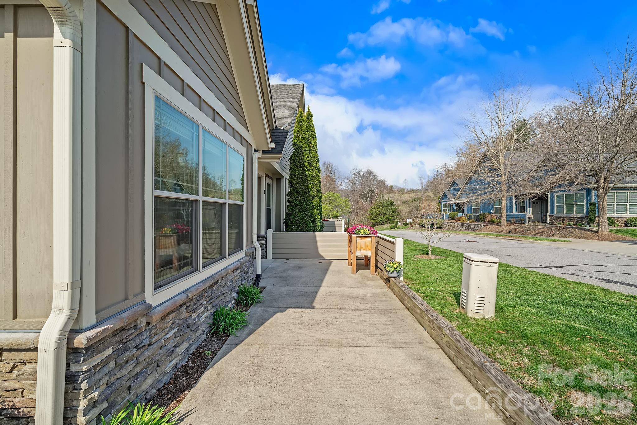 9 Brookstone Place Candler, NC 28715 - Photo 26 of 36 a swimming pool with outdoor seating and yard